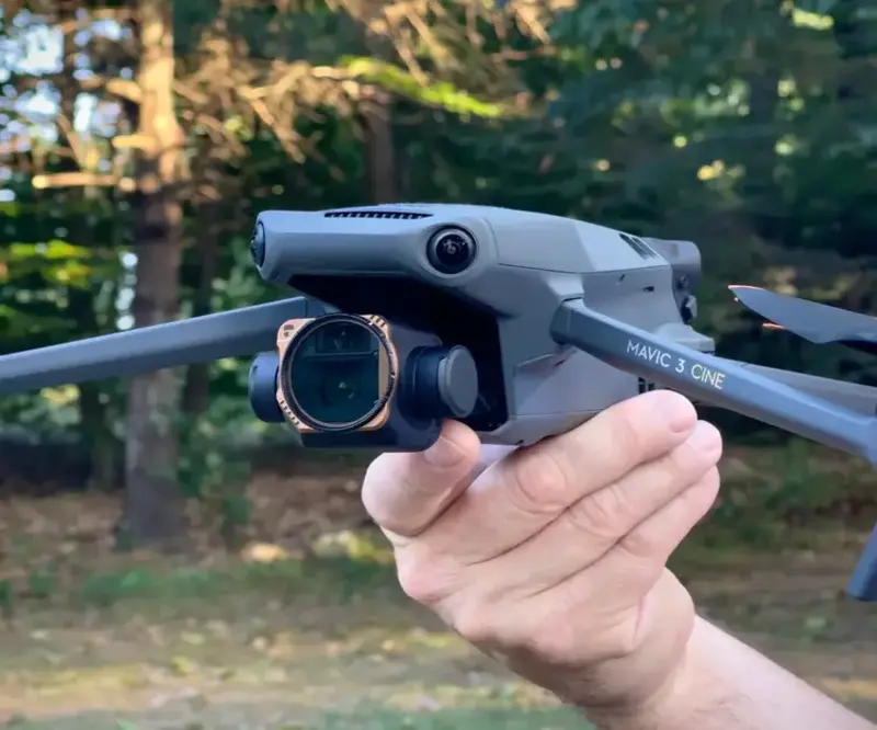 DJI Mavic 3 Cine drone held by hand for launch or recovery