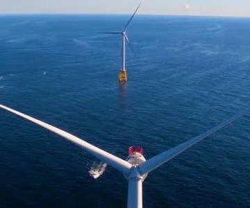 Drone flying over wind turbines off the coast of Block Island
