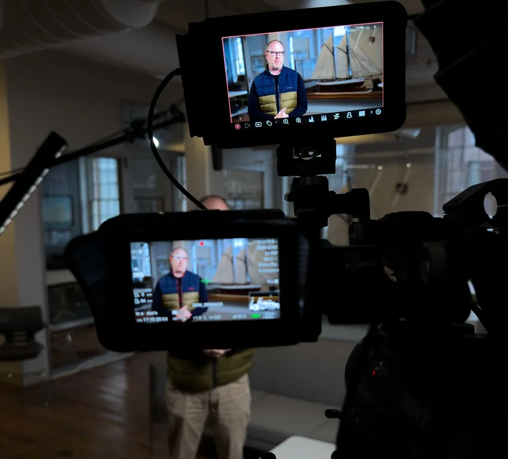 human videographer filming video content, showcasing human creativity in video production