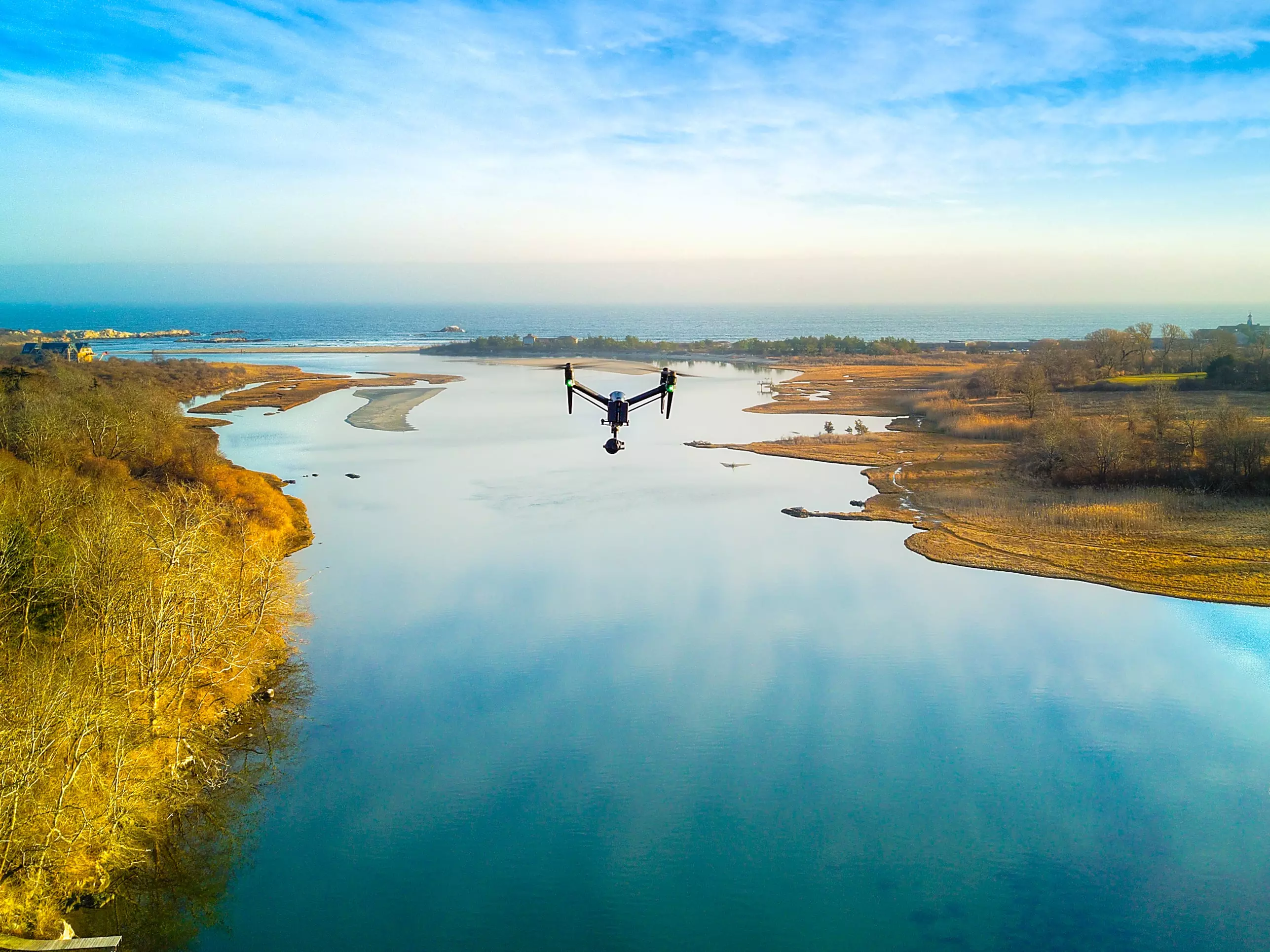 Drone flying over Narrow River in Narragansett RI, operated by Rhode Island licensed drone pilot, Sean McVeigh